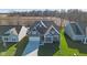 Aerial view of a two-story house with brick and siding, and a grassy yard at 9839 Canyon Ln, Pendleton, IN 46064