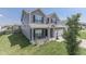 Two-story house with gray siding, brick accents, and a two-car garage at 2277 Maple Stone Ln, Greenwood, IN 46143