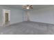 Main bedroom with grey carpet, ceiling fan and two closets at 2277 Maple Stone Ln, Greenwood, IN 46143