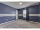 Empty bedroom with gray carpet and blue walls at 2277 Maple Stone Ln, Greenwood, IN 46143