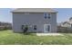 Gray house with fenced backyard, patio, and small garden at 2277 Maple Stone Ln, Greenwood, IN 46143