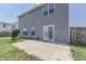 Gray house with fenced backyard, patio, and small garden at 2277 Maple Stone Ln, Greenwood, IN 46143