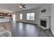 Open concept living room with kitchen views and fireplace at 2277 Maple Stone Ln, Greenwood, IN 46143