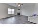Living room with white couch, fireplace, and wood-look floors at 2277 Maple Stone Ln, Greenwood, IN 46143