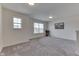 Bright bonus room with grey carpet and window at 2277 Maple Stone Ln, Greenwood, IN 46143