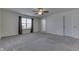 Main bedroom with grey carpet, ceiling fan and window at 2277 Maple Stone Ln, Greenwood, IN 46143