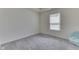 Bright bedroom with grey carpet and a window at 2277 Maple Stone Ln, Greenwood, IN 46143