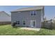 Gray house with fenced backyard, patio, and small garden at 2277 Maple Stone Ln, Greenwood, IN 46143