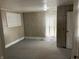 Simple bedroom with wood paneled walls and carpeted floor at 2506 Morton St, Anderson, IN 46016