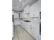 Modern kitchen with white cabinets and quartz countertops at 11419 Neptune Dr, Fishers, IN 46040