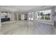 Spacious great room featuring hardwood floors and sliding barn doors at 11419 Neptune Dr, Fishers, IN 46040