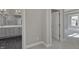 Gray vanity with double sinks and marble floor at 11419 Neptune Dr, Fishers, IN 46040