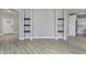Bright entryway with hardwood floors and built-in shelving at 11419 Neptune Dr, Fishers, IN 46040