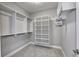 Spacious walk-in closet with shelves and hanging rods at 11419 Neptune Dr, Fishers, IN 46040