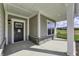 Front porch with dark brown door and stone accents at 11419 Neptune Dr, Fishers, IN 46040