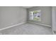 Bright and airy office space with neutral walls and carpet at 11419 Neptune Dr, Fishers, IN 46040