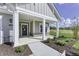 Covered front porch with stone and white columns at 11419 Neptune Dr, Fishers, IN 46040