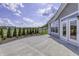 Large concrete patio with double French doors at 11419 Neptune Dr, Fishers, IN 46040