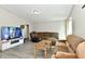 Spacious living room featuring a large sectional sofa and a modern entertainment center at 2813 Grassy Creek Dr, Indianapolis, IN 46229