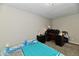 Bright bedroom with double bed, workspace, and ample floor space at 2813 Grassy Creek Dr, Indianapolis, IN 46229
