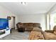 Relaxing living room with sectional sofa, wood flooring, and access to backyard at 2813 Grassy Creek Dr, Indianapolis, IN 46229