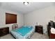 Cozy bedroom with a double bed, nightstands, and window coverings at 2813 Grassy Creek Dr, Indianapolis, IN 46229