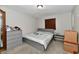 Well-lit bedroom featuring a gray double bed and ample dresser storage at 2813 Grassy Creek Dr, Indianapolis, IN 46229