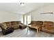 Bright living room with two sofas, a coffee table and sliding glass doors at 2813 Grassy Creek Dr, Indianapolis, IN 46229