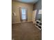 Spacious bedroom with carpeted floors, window with curtains, and plenty of natural light at 32 E Caven St, Indianapolis, IN 46225