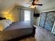 Comfortable bedroom with a ceiling fan and window with curtains at 32 E Caven St, Indianapolis, IN 46225