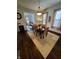 Spacious dining room with hardwood floors, chandelier, and view into living room at 32 E Caven St, Indianapolis, IN 46225