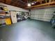 Garage with flake flooring, shelves, and bikes at 32 E Caven St, Indianapolis, IN 46225