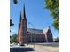Brick church with tall spires and ample parking at 32 E Caven St, Indianapolis, IN 46225