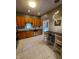 Modern kitchen with wood cabinets, stainless steel appliances, and marble flooring at 32 E Caven St, Indianapolis, IN 46225