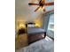 Well-lit bedroom with a queen-size bed and ceiling fan at 32 E Caven St, Indianapolis, IN 46225