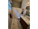 Clean bathroom with marble vanity, shower, and tile flooring at 32 E Caven St, Indianapolis, IN 46225