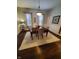 Charming dining room featuring hardwood floors, a formal dining table, and natural light at 32 E Caven St, Indianapolis, IN 46225