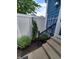 Small backyard with a concrete patio, arbor, and some plantings at 32 E Caven St, Indianapolis, IN 46225