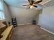 Second bedroom with chair and built-in shelving at 32 E Caven St, Indianapolis, IN 46225