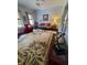 Inviting living room boasts hardwood floors, comfy furniture, and a large area rug at 32 E Caven St, Indianapolis, IN 46225