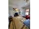 Spacious living room featuring hardwood floors, a staircase, and ample natural light at 32 E Caven St, Indianapolis, IN 46225