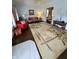 Bright living room with hardwood floors, comfy seating, and large area rug at 32 E Caven St, Indianapolis, IN 46225