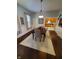 Elegant dining room with hardwood floors, chandelier, and a view of the kitchen at 32 E Caven St, Indianapolis, IN 46225