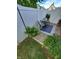 Cozy patio area with a small table and chairs, and potted plants at 32 E Caven St, Indianapolis, IN 46225