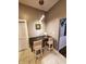 Kitchen breakfast bar with granite countertop and two modern chairs at 32 E Caven St, Indianapolis, IN 46225