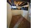 Unfinished basement with ample storage space and a concrete floor at 32 E Caven St, Indianapolis, IN 46225