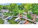 Aerial view showing waterfront home, boat dock, and lush green landscaping at 1160 Nantucket Dr, Cicero, IN 46034