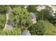 Aerial view of house nestled amongst large trees at 449 Emerson Rd, Carmel, IN 46032