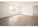 Spacious living room with wood-look flooring at 7721 Big Bend Blvd, Camby, IN 46113