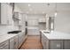 Spacious kitchen featuring an island and hardwood floors at 15798 Vitalize Run, Fishers, IN 46040